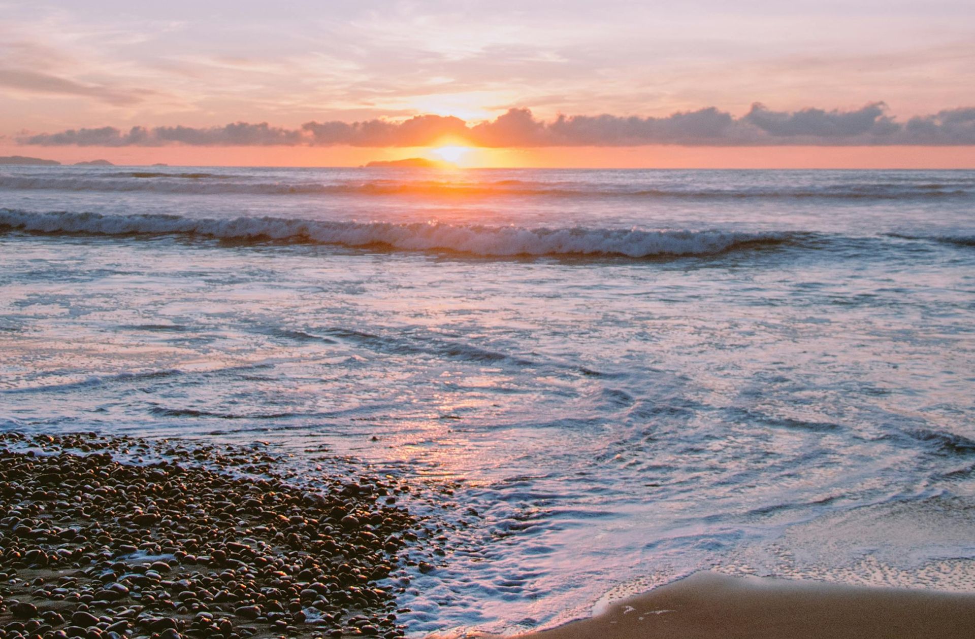 Peaceful sunrise at Tijuana beach, capturing the warm glow over the ocean waves.